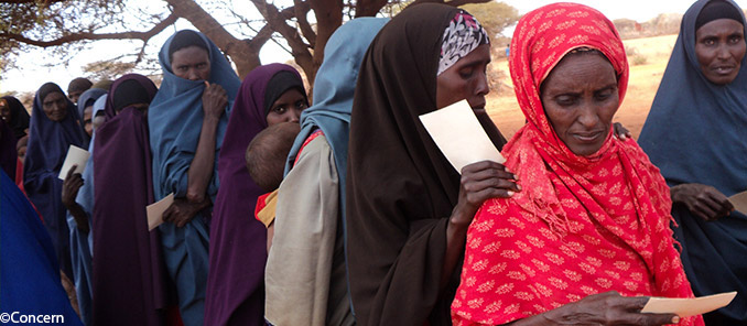 Beneficiaries holding food vouchers to collect food in Dollow. Photographer: Jennifer O’Gorman/Concern